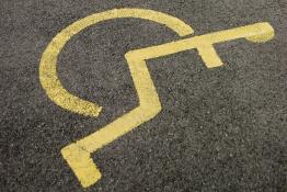 Painted wheelchair symbol in a disabled parking space