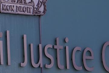 Sign outside Manchester Civil Justice Centre