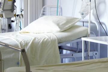A row of three hospital beds